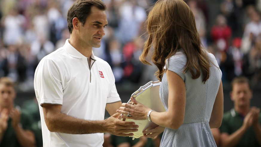 Switzerland&#039;s Roger Federer receives the runner up trophy from Kate, Duchess of Cambridge after losing to Serbia&#039;s Novak Djokovic in the men&#039;s singles final match of the Wimbledon Tenni ...