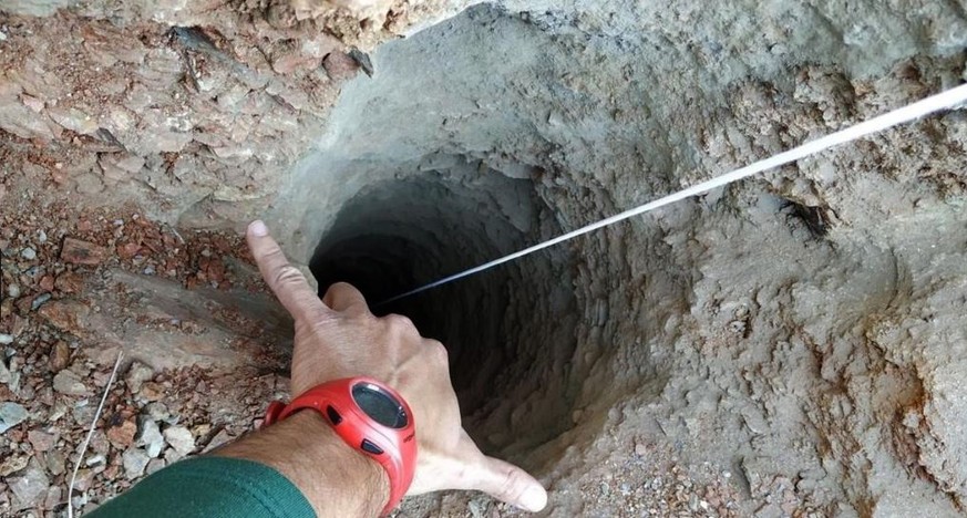 epa07285714 A handout photo made available by the Fire brigades of Malaga shows the 30 centimeters wide borehole in which a two-year-old fell down in the town of Totalan in Malaga, southeastern Spain, ...