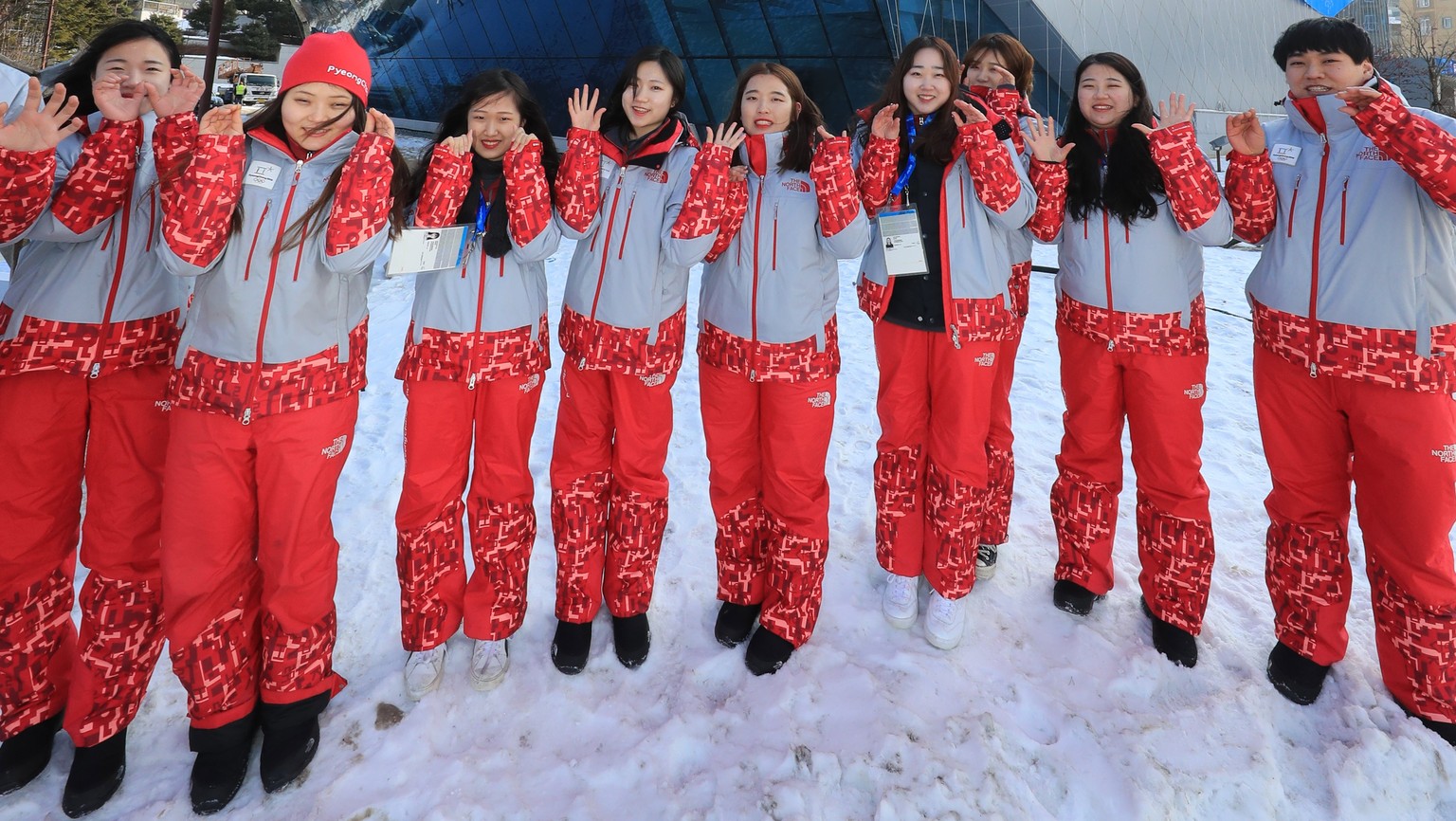 epa06426124 A group of volunteers poses for a photo in front of the Main Press Center (MPC) in the Alpensia Resort in PyeongChang, an alpine town in South Korea&#039;s northeastern province of Gangwon ...