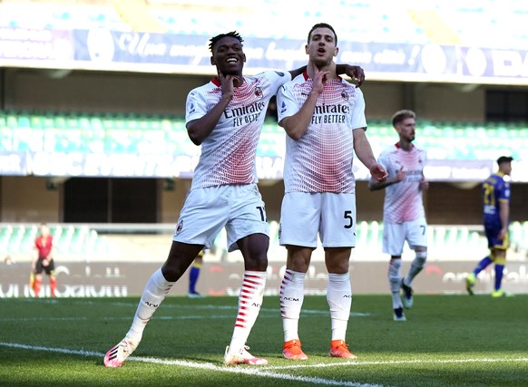 AC Milan&#039;s Jose Diogo Dalot Teixeira, right, celebrates with his teammate Rafael Leao after scoring his side&#039;s second goal during a Serie A soccer match between Hellas Verona and AC Milan, a ...