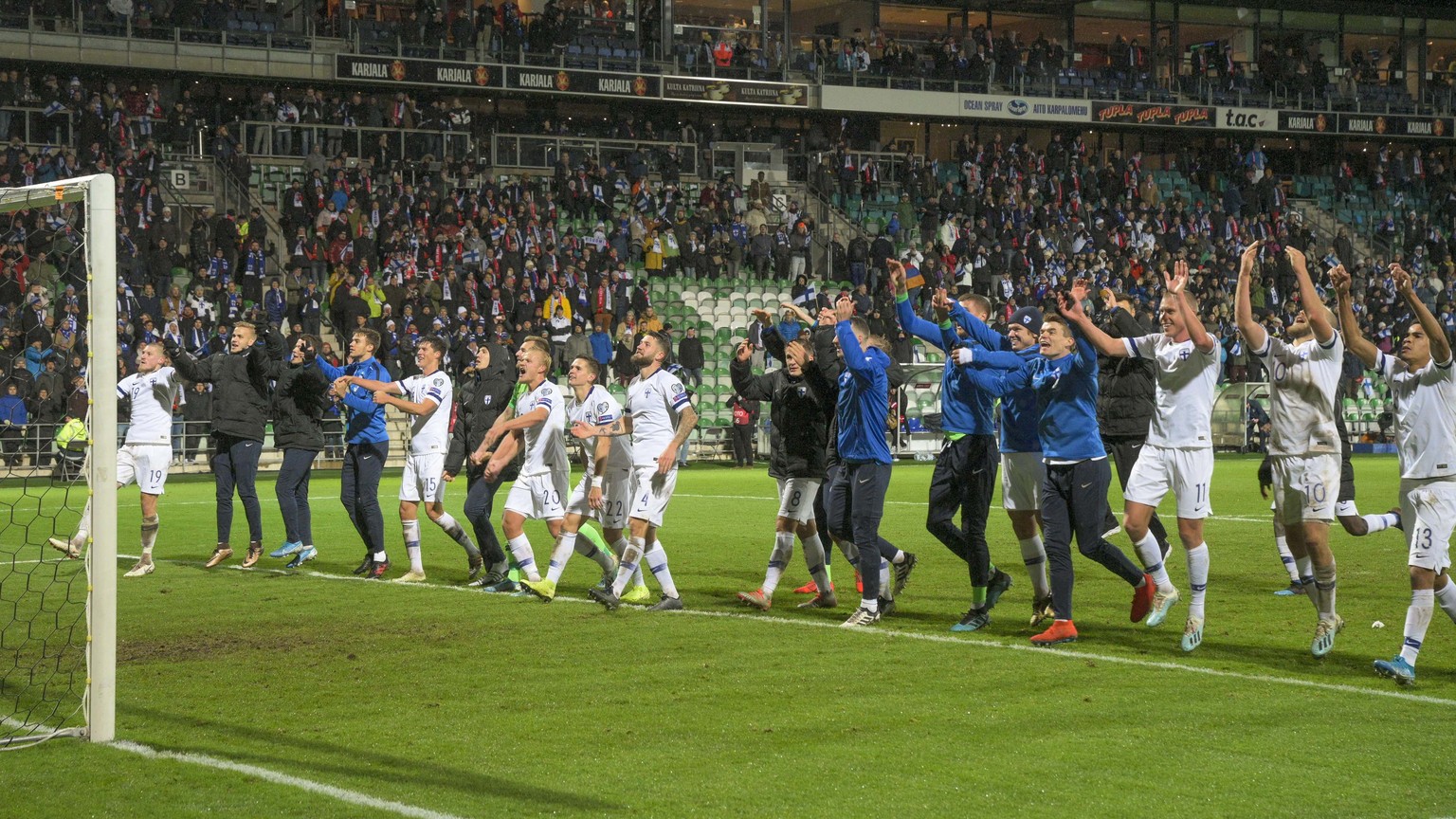 epa07923471 Finnish team celebrates with supporters after the UEFA EURO 2020 qualifiers match between Finland and Armenia at the Veritas Stadium in Turku, Finland, 15 October 2019. EPA/VESA-MATTI VAAR ...