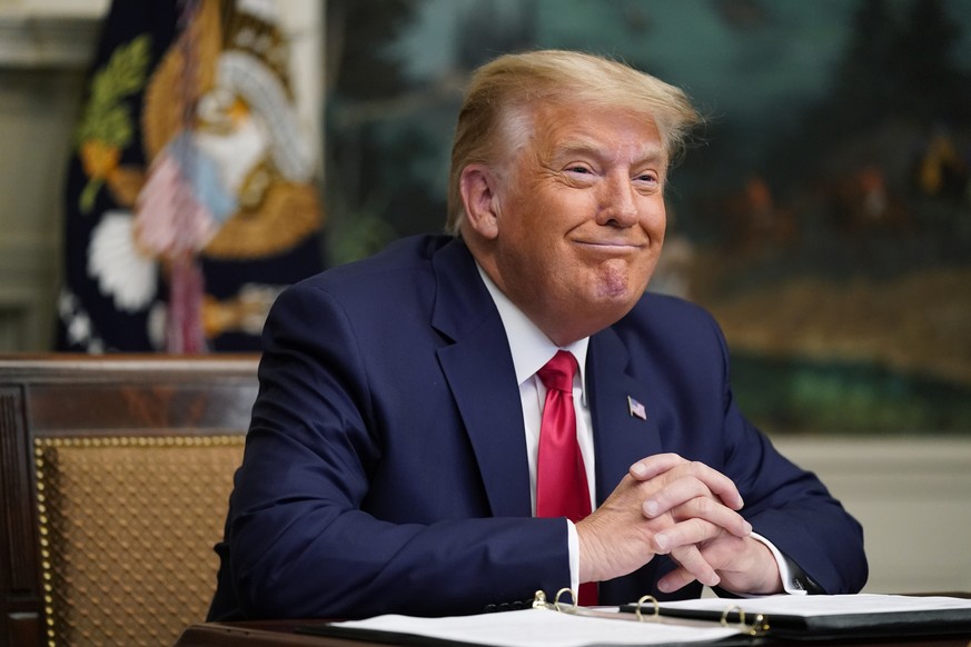 President Donald Trump participates in a video teleconference call with members of the military on Thanksgiving, Thursday, Nov. 26, 2020, at the White House in Washington. (AP Photo/Patrick Semansky)
 ...
