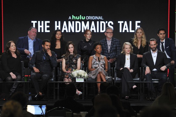 Cast members, front row from left, Ann Dowd, O-T Fagbenle, Alexis Bledel, Samira Wiley, Elisabeth Moss and Joseph Fiennes, rear row from left, Executive Producer Bruce Miller, Director/Executive Produ ...