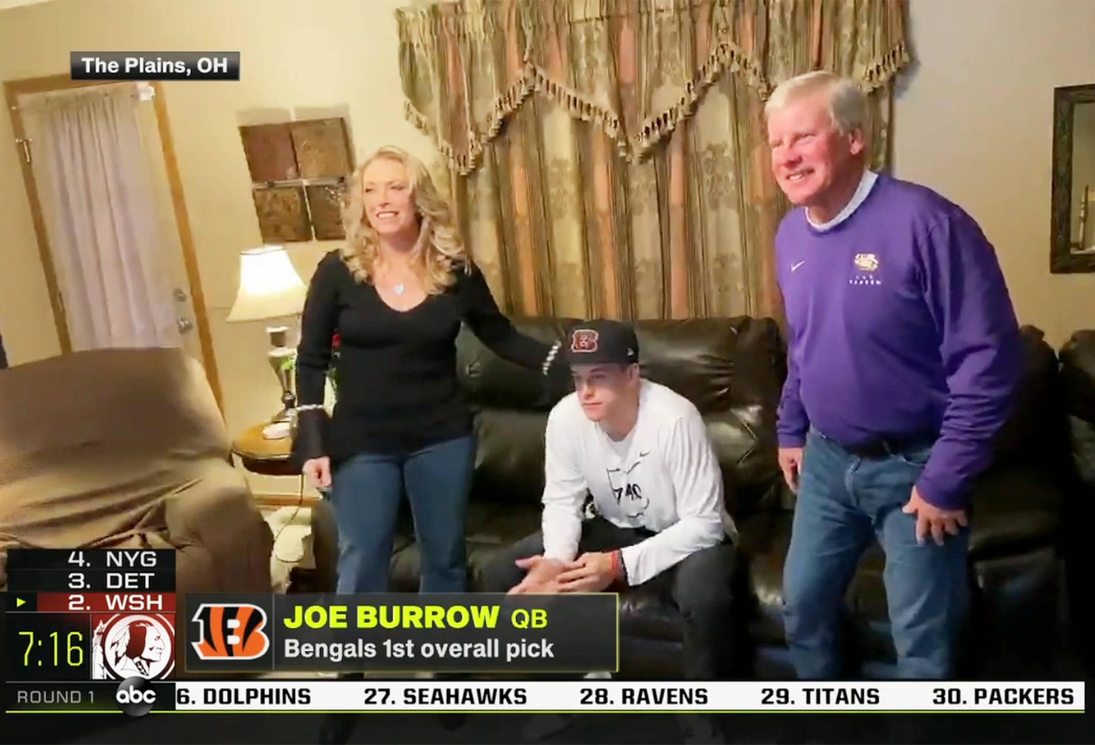 A screen grab of Louisiana State University quarterback Joe Burrow and family members reacting to being the NFL, American Football Herren, USA Draft 1 overall pick on a live broadcast is shown on Thur ...