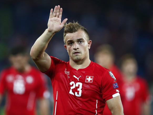 epa04551092 Swiss forward Xherdan Shaqiri waves to supporters as he leaves the pitch after the UEFA EURO 2016 qualifying soccer match between Switzerland and England at the St. Jakob-Park stadium in B ...
