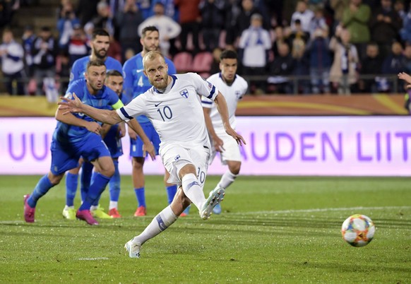 Teemu Pukki of Finland scores from the penalty spot during the Euro 2020 group J qualifying soccer match between Finland and Greece in Tampere, Finland, Thursday Sept. 5, 2019. (Markku Ulander/Lehtiku ...