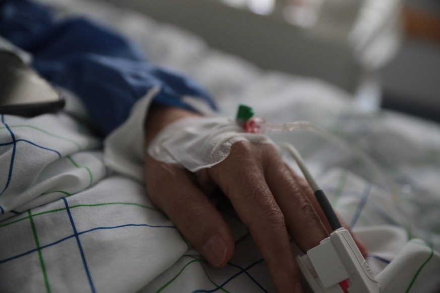 In this photo taken on Wednesday, April 15, 2020, a COVID-19 patient lies on a bed at one of the intensive care units (ICU) of the Moulay Abdellah hospital in Sale, Morocco. Coronavirus has upended li ...