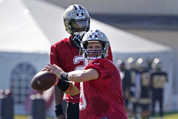 New Orleans Saints quarterback Drew Brees (9) passes as quarterback Jameis Winston (2) watches during practice at their NFL football training facility in Metairie, La., Saturday, Aug. 22, 2020. (AP Ph ...