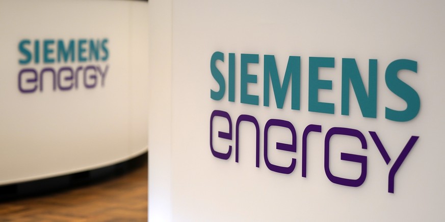 epa08703051 A view of Logos of Siemens Energy AG during the opening of the Initial public offering at the Stock Exchange in Frankfurt am Main, Germany, 28 September 2020. The Siemens Energy AG went pu ...