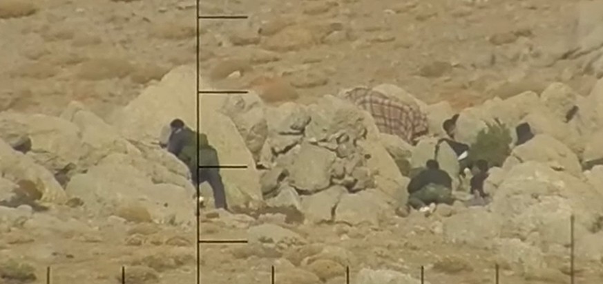 epa06702522 A handout video grab released 30 April 2018 taken from a video published online by &#039;Falter&#039; weekly, shows gunmen preparing an ambush at a Syrian police unit. Austria&#039;s Defen ...
