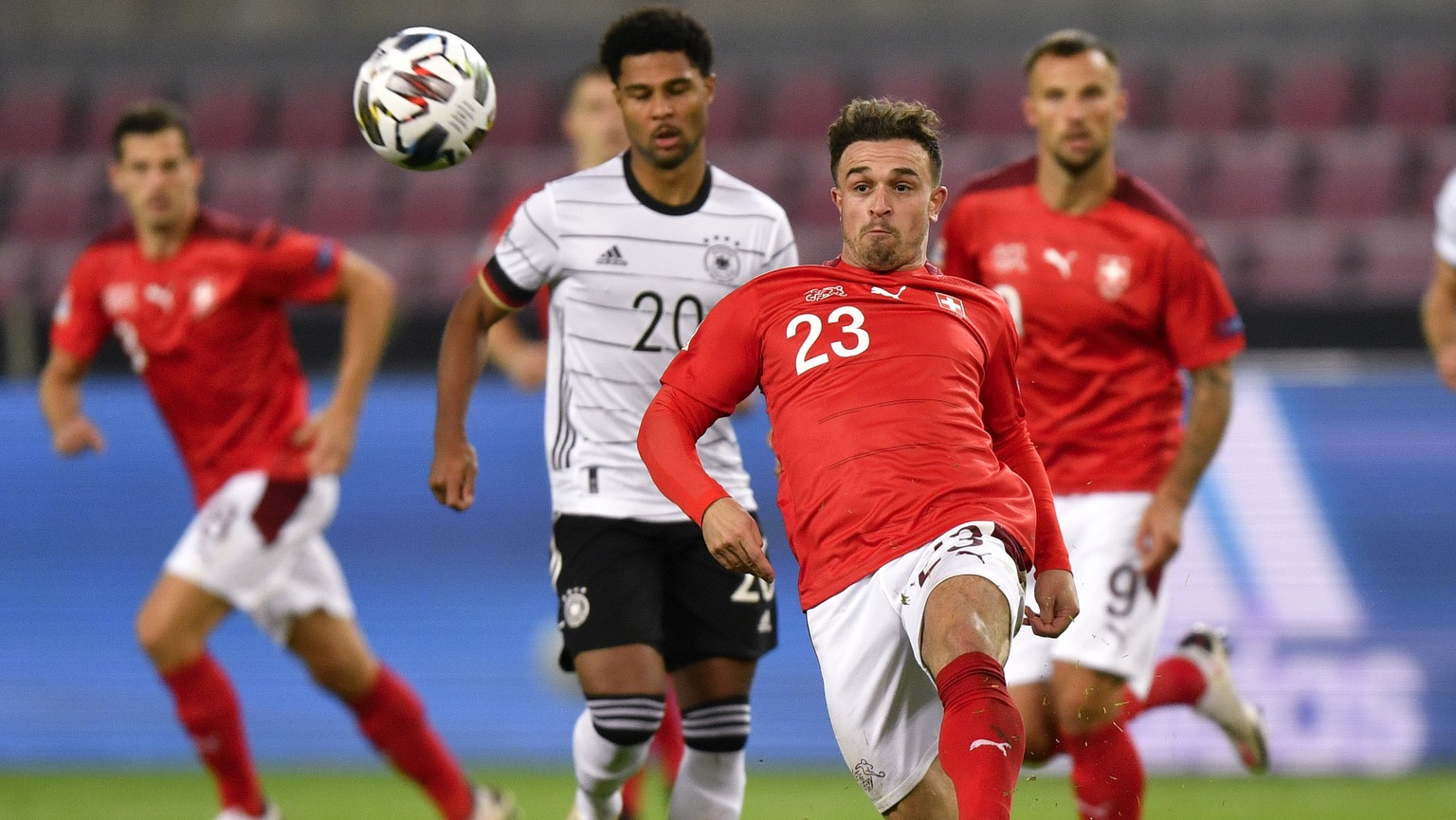 Switzerland&#039;s Xherdan Shaqiri kicks the ball away from Germany&#039;s Serge Gnabry during the UEFA Nations League soccer match between Germany and Switzerland in Cologne, Germany, Tuesday, Oct. 1 ...