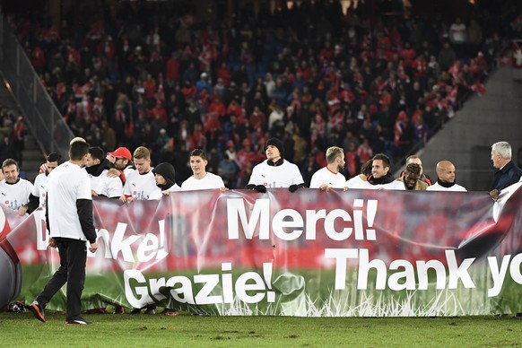 Players and staff of Team Switzerland celebrate after the 2018 Fifa World Cup play-offs second leg soccer match Switzerland against Northern Ireland at the St. Jakob-Park stadium in Basel, Switzerland ...