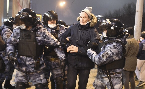 Police detain a man during a protest against the jailing of opposition leader Alexei Navalny in Moscow, Russia, Saturday, Jan. 23, 2021. Russian police on Saturday arrested hundreds of protesters who  ...