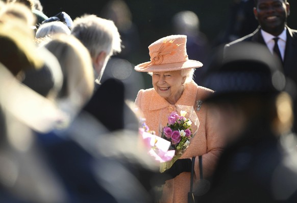 Britain&#039;s Queen Elizabeth II meets with members of the public outside the grounds of St Peter and St Paul church, in West Newton, England, after attending a Sunday service, Sunday Feb. 3, 2019. ( ...