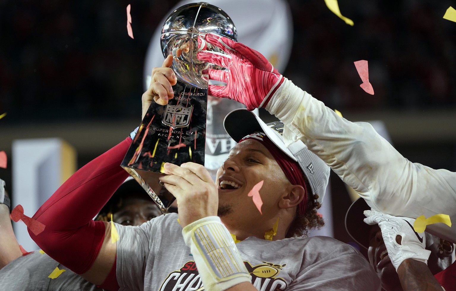 Kansas City Chiefs&#039; Patrick Mahomes hoists the trophy after defeating the San Francisco 49ers in the NFL Super Bowl 54 football game Sunday, Feb. 2, 2020, in Miami Gardens, Fla. (AP Photo/David J ...