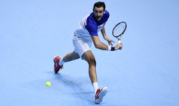 epa06328692 Marin Cilic of Croatia in action during his men&#039;s singles match against Jack Sock of the USA at the ATP World Tour Finals tennis tournament in London, Britain, 14 November 2017. EPA/W ...
