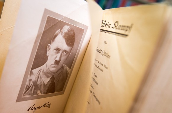 epa05092752 A picture made available on 08 January 2016 shows a copy of the original edition of the book &#039;Mein Kampf&#039; (lit. My Struggle) written by Nazi leader Adolf Hitler with portrait of  ...