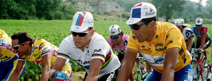 World cycling champion Lance Armstrong of Plano, Texas, left, is seen with overall leader Miguel Indurain of Spain during the 11th stage of the 81st Tour de France cycling race between Cahors and the  ...