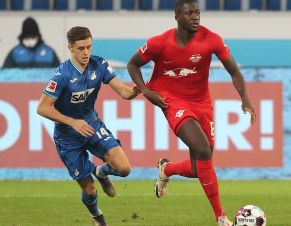 epa08888508 Hoffenheim&#039;s Austrian midfielder Christoph Baumgartner (L) vies with Leipzig&#039;s French defender Ibrahima Konate for the ball during the German Bundesliga soccer match between TSG  ...