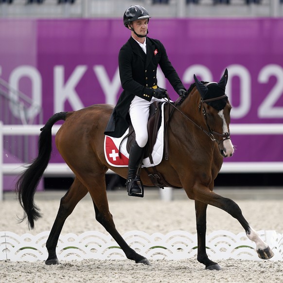 Switzerland&#039;s Robin Godel, riding Jet Set, competes during the equestrian eventing dressage at Equestrian Park at the 2020 Summer Olympics, Saturday, July 31, 2021, in Tokyo, Japan. (AP Photo/Car ...