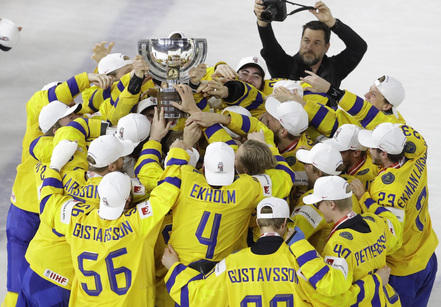 Sweden&#039;s players celebrate with the trophy their victory over Switzerland in the Ice Hockey World Championships final match between Sweden and Switzerland at the Royal arena in Copenhagen, Denmar ...