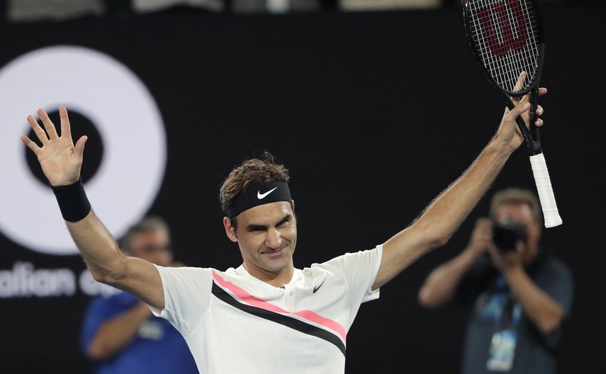 Switzerland&#039;s Roger Federer celebrates after defeating Tomas Berdych of the Czech Republic in their quarterfinal at the Australian Open tennis championships in Melbourne, Australia, Wednesday, Ja ...