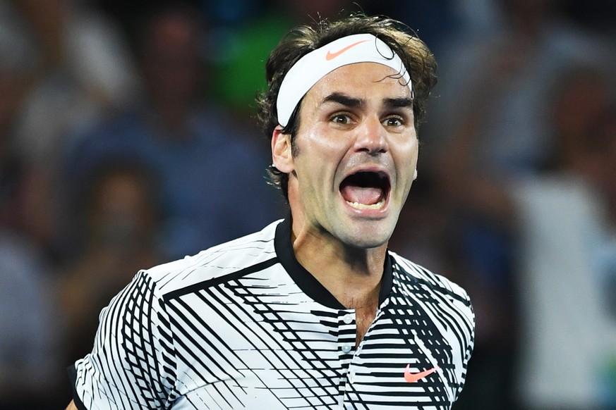 epa05759209 Roger Federer of Switzerland celebrates winning against Rafael Nadal of Spain during the finals of the Men&#039;s Singles at the Australian Open Grand Slam tennis tournament in Melbourne,  ...