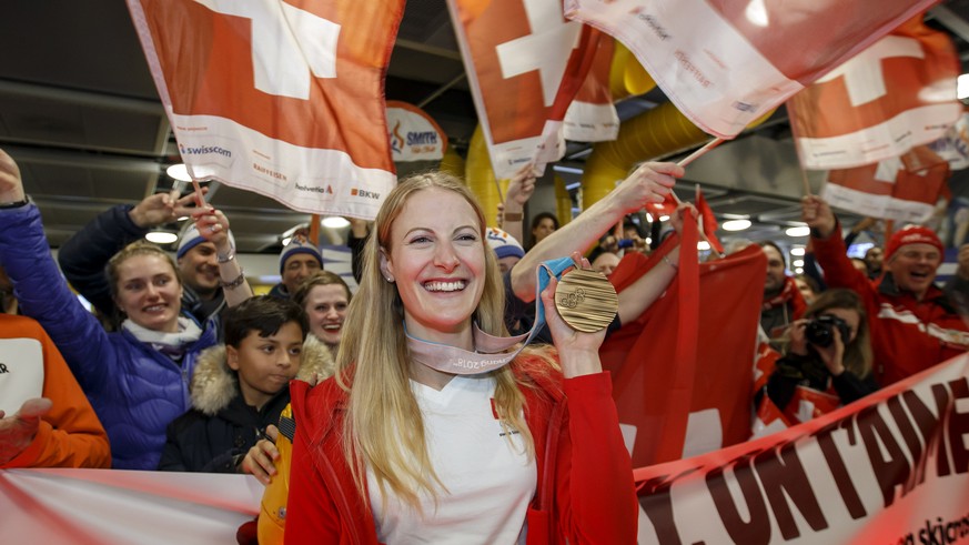 SwitzerlandÕs Fanny Smith, bronze medal in the Ski Cross, poses for the photographers and Swiss fans when arriving in Geneva Airport after the 2018 PyeongChang Winter Olympic Games, in Geneva, Switzer ...