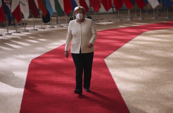 epa08554348 Germany&#039;s Chancellor Angela Merkel arrives for the third day of the European Council in Brussels, Belgium, 19 July 2020. European Union nations leaders meet face-to-face for a third d ...