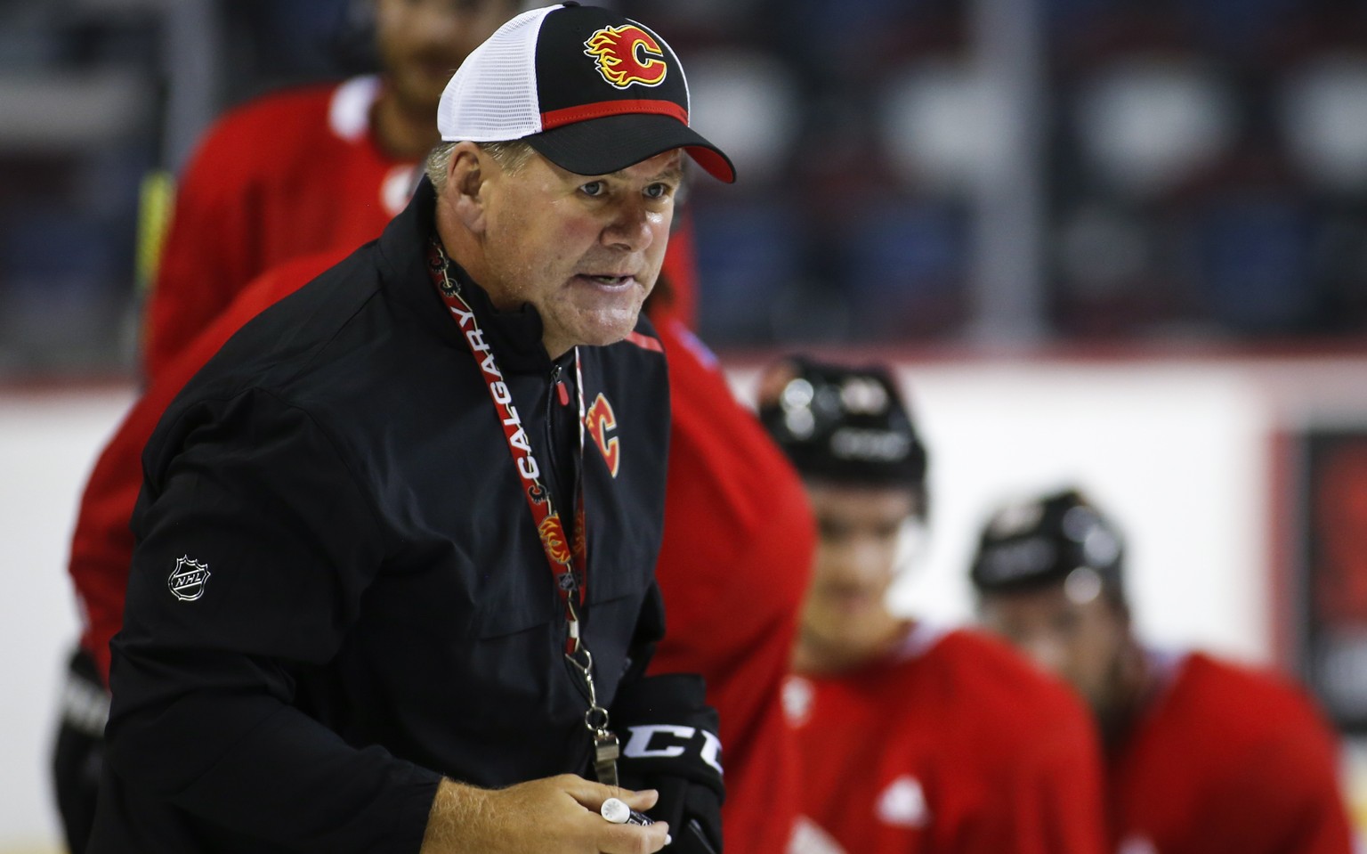 Calgary Flames head coach Bill Peters gives instruction during NHL hockey training camp in Calgary, Friday, Sept. 13, 2019. (Jeff McIntosh/The Canadian Press via AP)