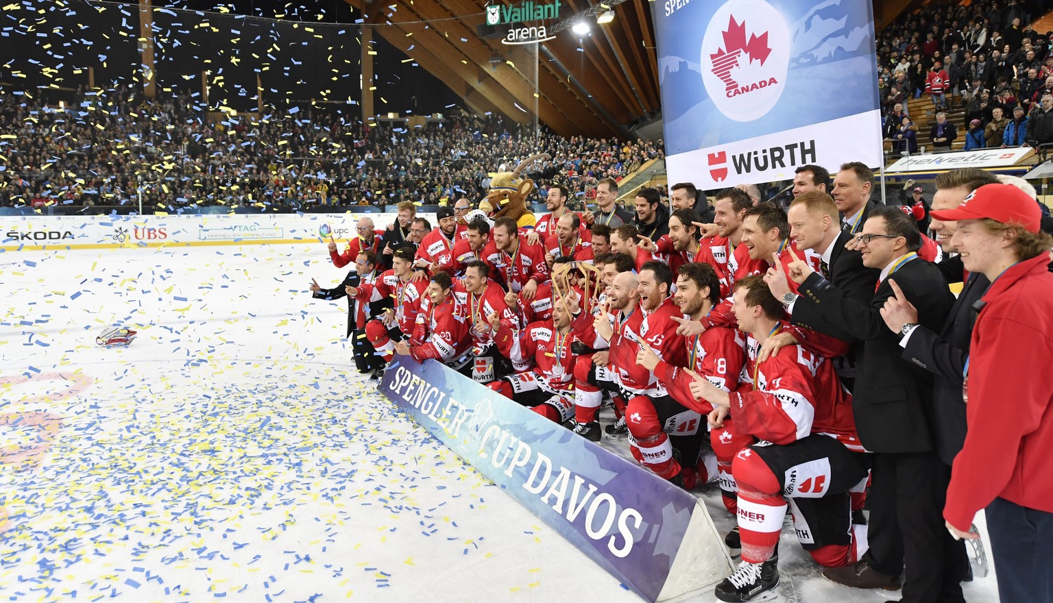 epa05692622 Team Canada poses with the Spengler Cup Trophy after the final game between Team Canada and HC Lugano, at the 90th Spengler Cup ice hockey tournament in Davos, Switzerland, Saturday, Decem ...