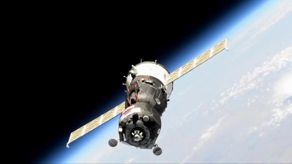 epa07790145 A handout photo dated 24 August 2019 and made available by NASA, showing the unpiloted Soyuz MS-14 spacecraft pictured near the International Space Station. The spacecraft containing Fedor ...