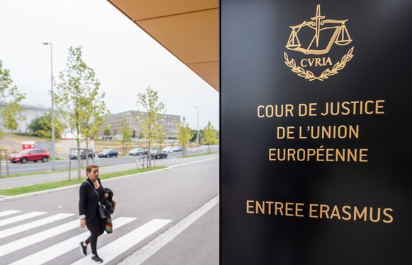 In this photo taken on Monday, Oct. 5, 2015 a woman walks by the entrance to the European Court of Justice in Luxembourg. Europe&#039;s highest court has ruled in favor of an Austrian law student who  ...