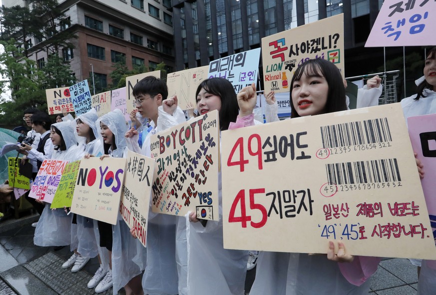 South Korean high school students shout slangs during a rally denouncing the Japanese government&#039;s decision on their exports to South Korea in front of the Japanese embassy in Seoul, South Korea, ...
