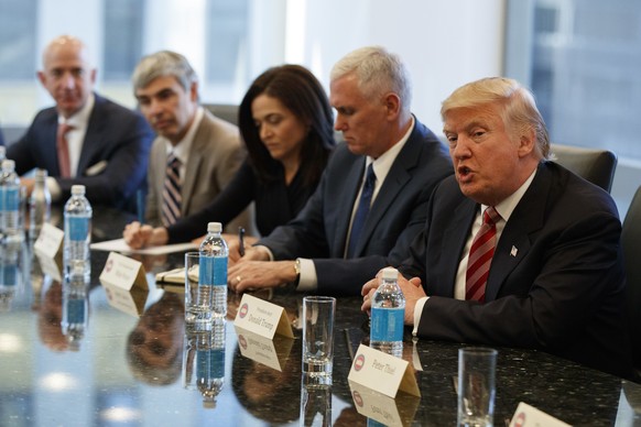 President-elect Donald Trump speaks during a meeting with technology industry leaders at Trump Tower in New York, Wednesday, Dec. 14, 2016. From left are, Amazon founder Jeff Bezos, Alphabet CEO Larry ...