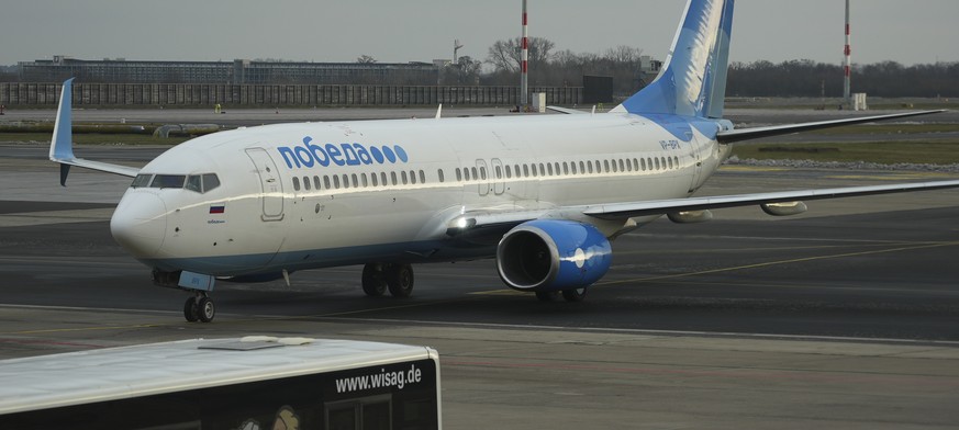 Boeing 737-800 of Pobeda Russian air company on which Alexei Navalny is expected to fly to Moscow, as it arrives to the Airport Berlin Brandenburg (BER) in Schoenefeld, near Berlin, Germany, Sunday, J ...