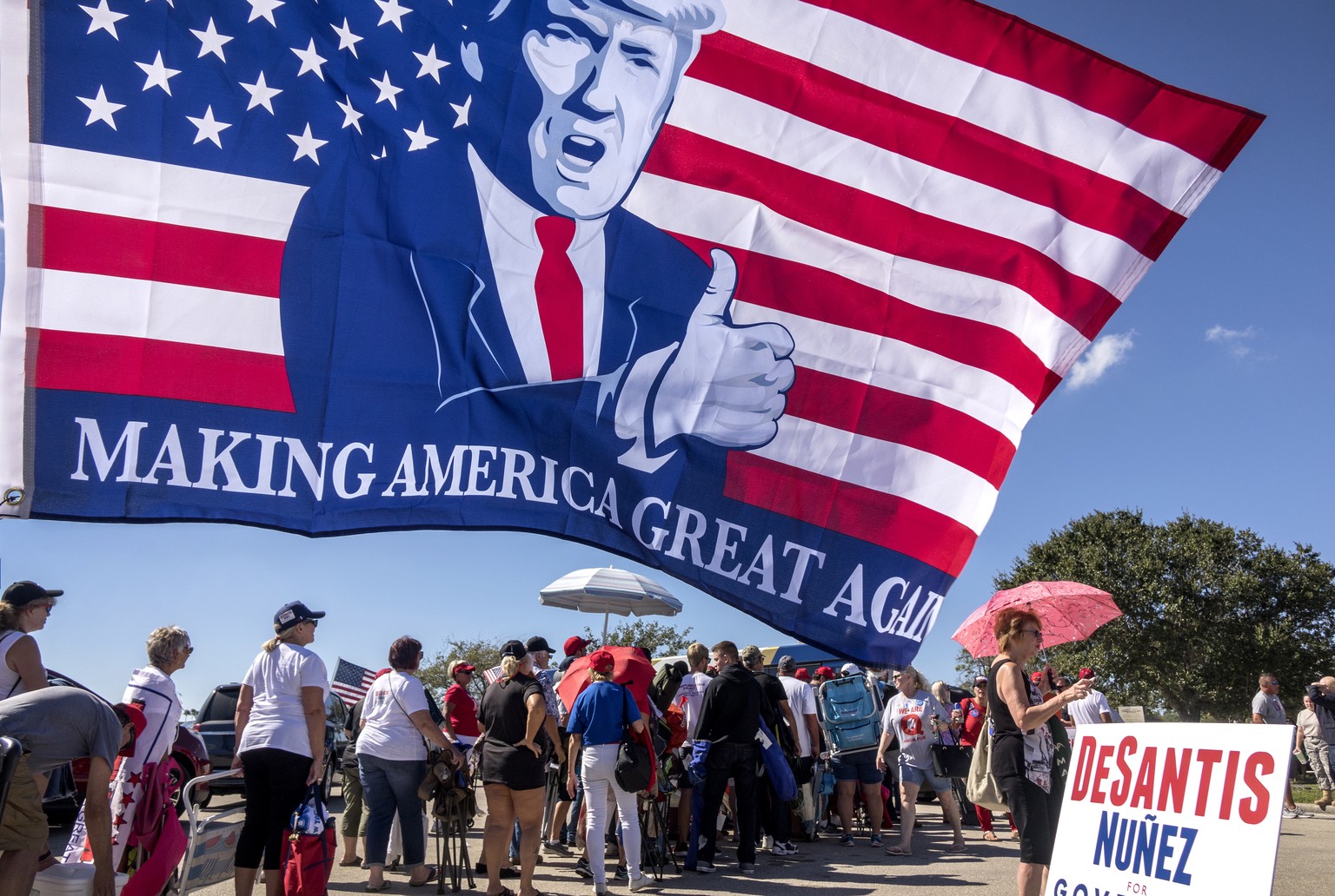 epa07133997 US President Donald J. Trump’s supporters make a line to attend the Make America Great Again Rally in Hertz Arena, Fort Myers, Florida, USA, 31 October 2018. Trump holds a national midterm ...