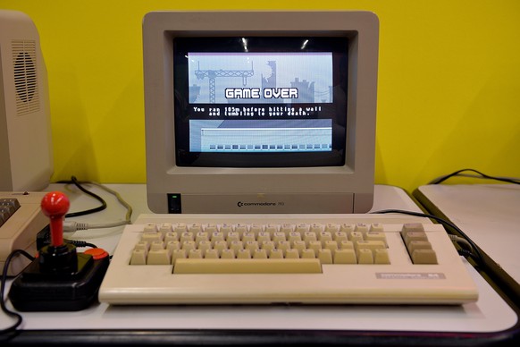 COLOGNE, GERMANY - AUGUST 14: A Commodore C64 computer is seen at the event and entertainment area at the 2014 Gamescom gaming trade fair on August 14, 2014 in Cologne, Germany. Gamescom is the world& ...