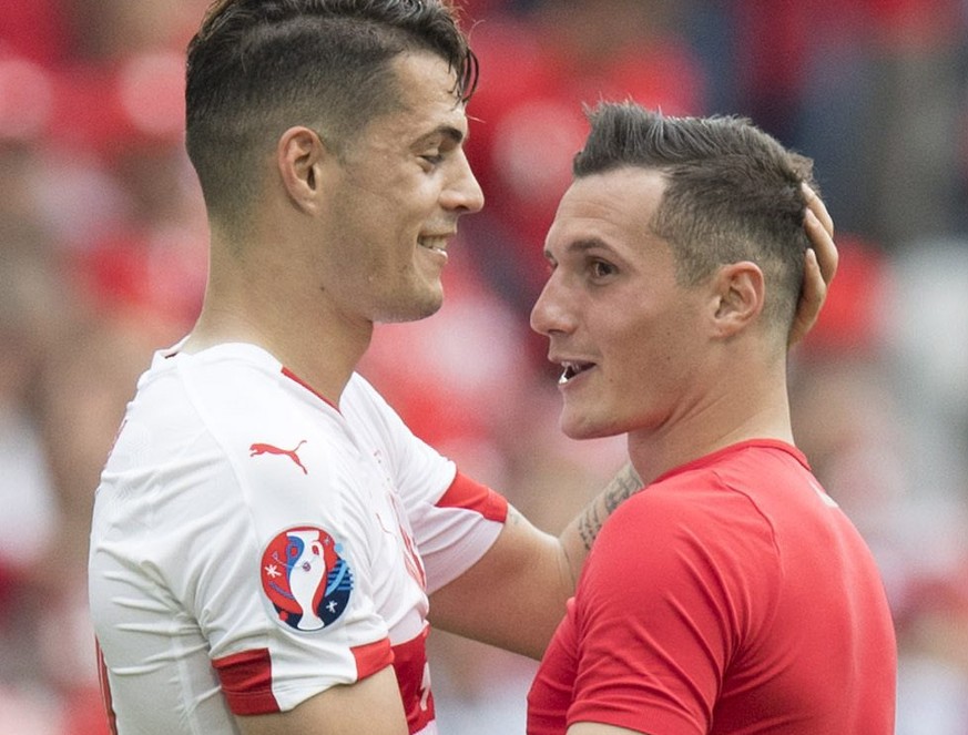 epa05357283 Swiss midfielder Granit Xhaka (L) cheers with his brother Albania&#039;s midfielder Taulant Xhaka after the UEFA EURO 2016 group A preliminary round match between Albania and Switzerland a ...