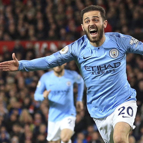 Manchester City&#039;s Bernardo Silva celebrates after scoring the opening goal during the English Premier League soccer match between Manchester United and Manchester City at Old Trafford Stadium in  ...