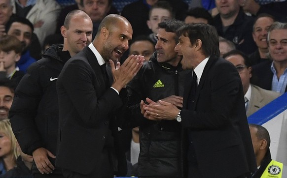 epa05891039 Chelsea&#039;s manager Antonio Conte (R) and Manchester City&#039;s manager Pep Guardiola (2-L) react during the English Premier League soccer match between Chelsea FC and Manchester City  ...