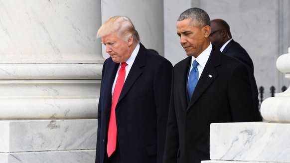 FILE PHOTO - U.S. President Donald Trump and former President Barack Obama walk out of the East front prior to Obama&#039;s departure from the 2017 Presidential Inauguration at the U.S. Capitol in Was ...