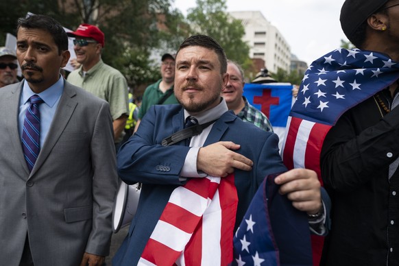 epaselect epa06946789 White supremacist Jason Kessler (C) and members of the alt-right march to the White House on the anniversary of last year&#039;s &#039;Unite the Right&#039; rally in Washington,  ...