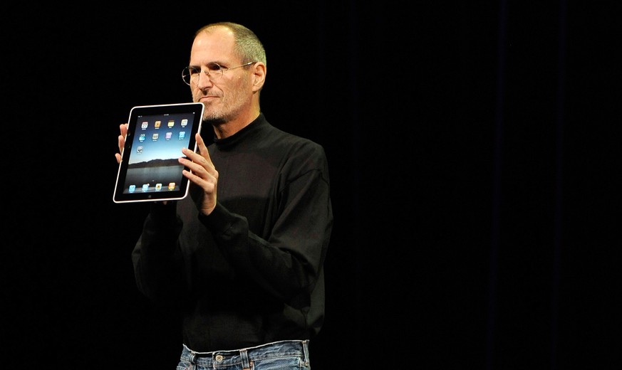 epa08095834 PICTURES OF THE DECADE ..Apple CEO and co-founder Steve Jobs unveils the iPad during an Apple event at the Yerba Buena Center for the Arts Theater in San Francisco, California, USA, 27 Jan ...