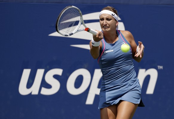 Timea Bacsinszky, of Switzerland, returns a shot to Aleksandra Krunick, of Russia, during the first round of the U.S. Open tennis tournament, Tuesday, Aug. 28, 2018, in New York. (AP Photo/Kevin Hagen ...