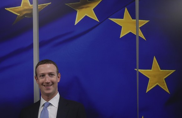 Facebook CEO Mark Zuckerberg smiles as he shakes hands with European Commissioner for Values and Transparency Vera Jourova prior to a meeting at EU headquarters in Brussels, Monday, Feb. 17, 2020. (AP ...