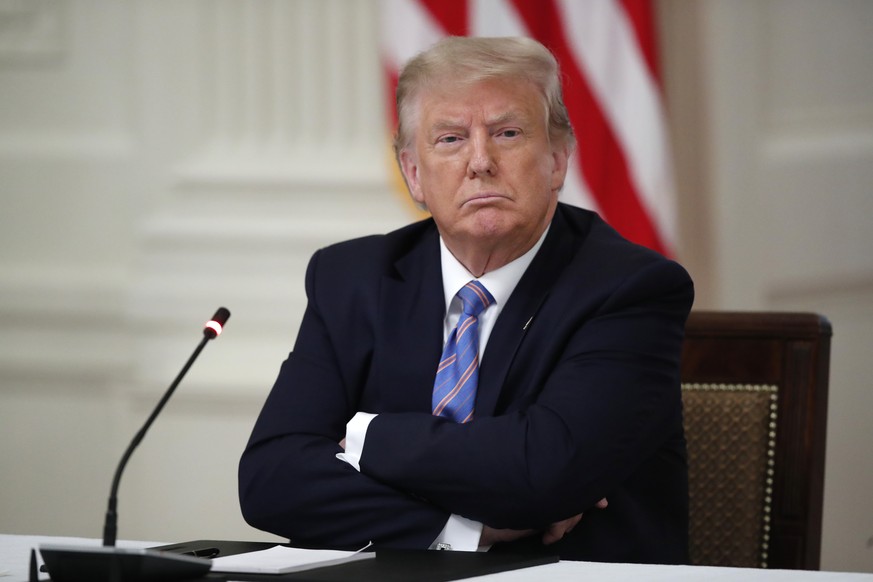 President Donald Trump listens during a &quot;National Dialogue on Safely Reopening America&#039;s Schools,&quot; event in the East Room of the White House, Tuesday, July 7, 2020, in Washington. (AP P ...