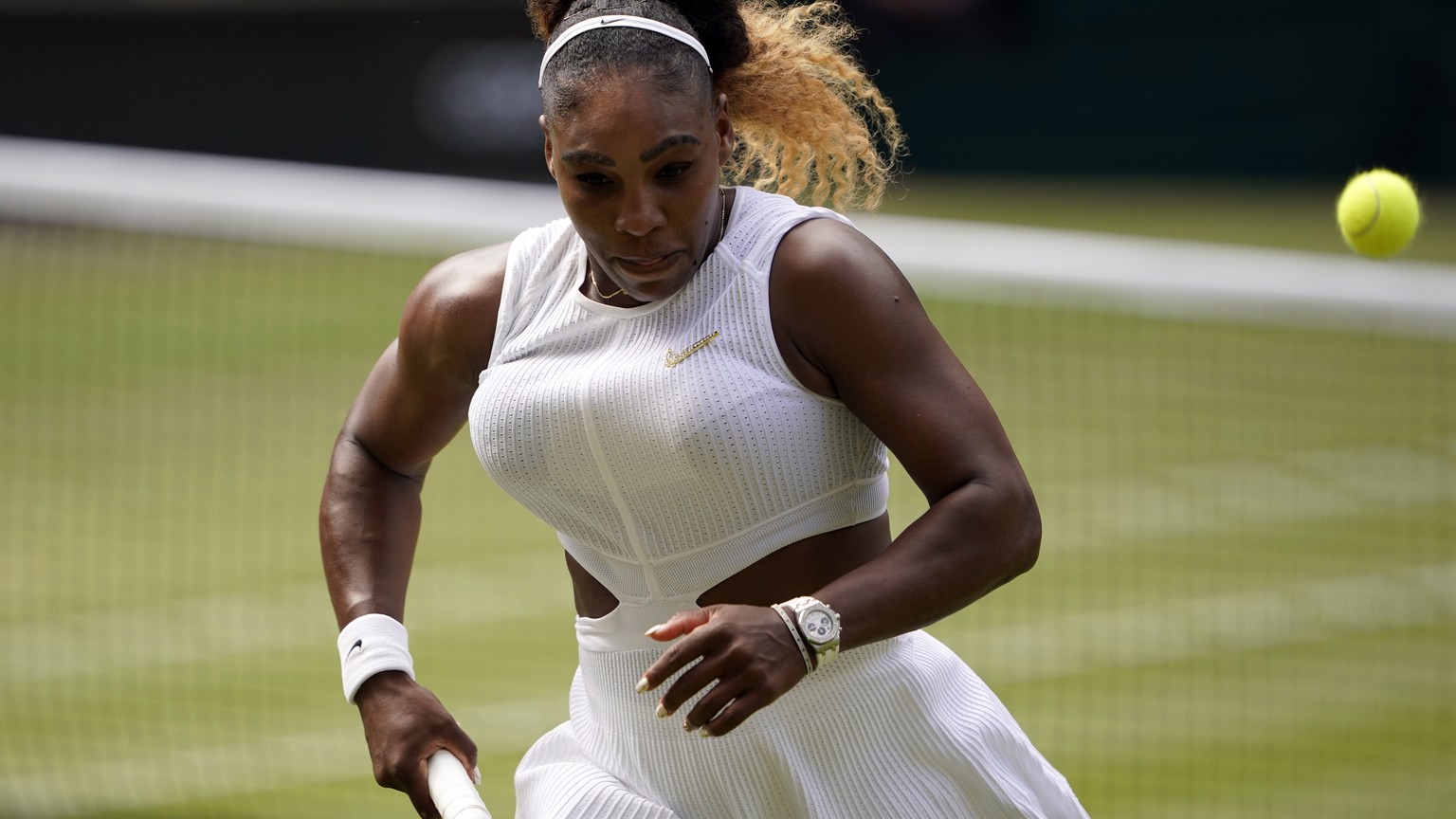 epa07710277 Serena Williams of the US in action against Barbora Strycova of the Czech Republic in their semi final match during the Wimbledon Championships at the All England Lawn Tennis Club, in Lond ...