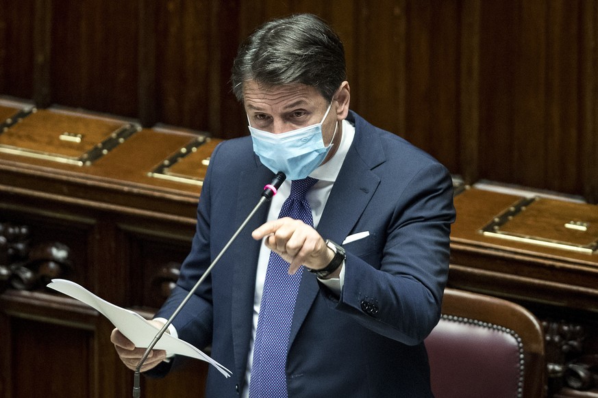 Prime Minister Giuseppe Conte briefs the Lower Chamber on the COVID-19 situation and on new measures being taken to curb the spread of the pandemic. (Roberto Monaldo/LaPresse via AP)