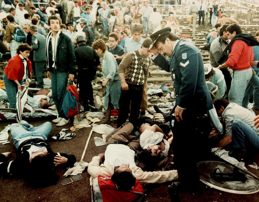 Photo dated 29 May 1985 shows injured spectators in the Heysel stadium in Brussels after violent clashes between Juventus Turin and Liverpool fans prior to the European Champions Cup final. The Heysel ...